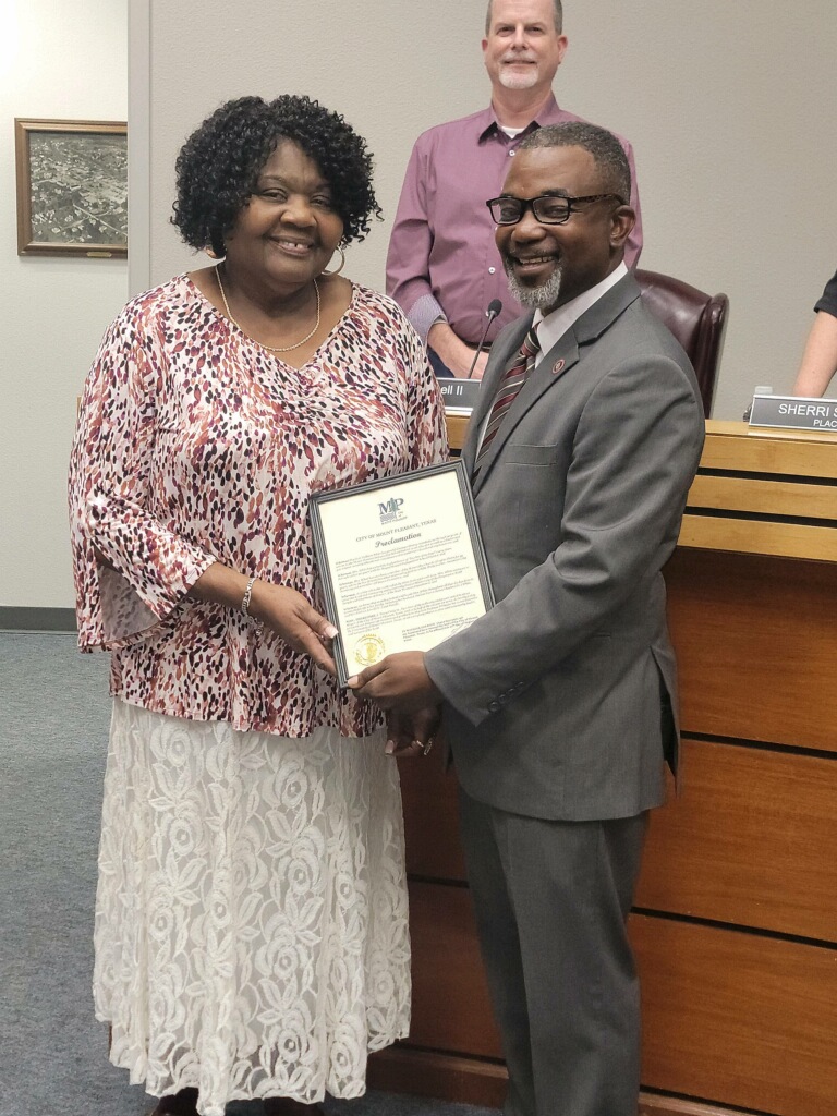 Mrs. Mae White receives a Proclamation from Mayor Craig