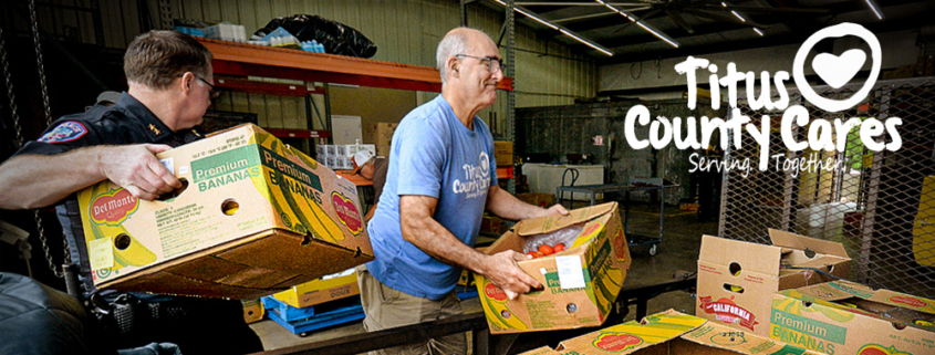 Volunteers loading shelves in the TCC food bank.