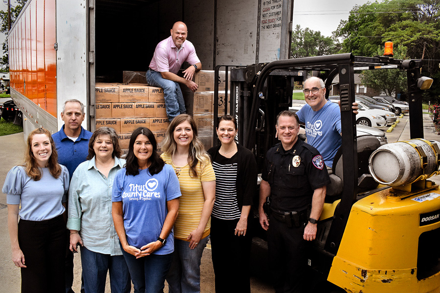 Volunteer group shot at Titus County Cares food bank.