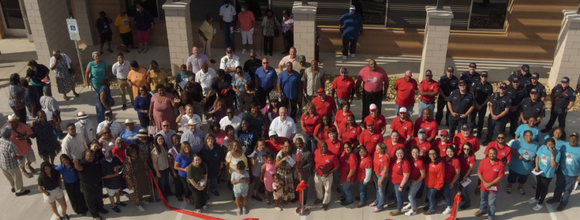 Citizens and Dignitaries gathered in front of the Pilgrim's Center at the Ribbon Cutting.